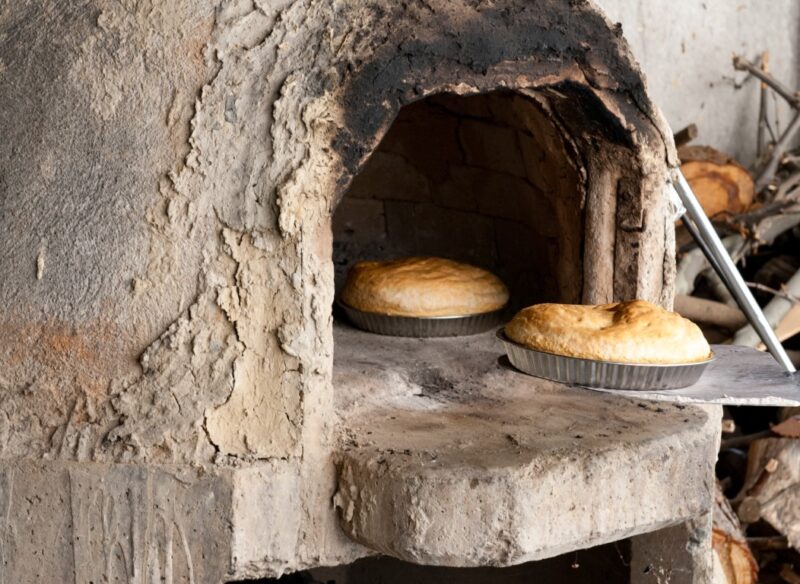 Fresh homemade bread cooked on a traditional clay oven. Home bakery